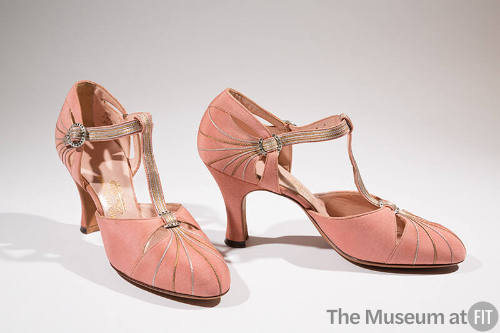 Pair of pink T-strap evening shoes with silver and gold piping running from toes to T-strap and…