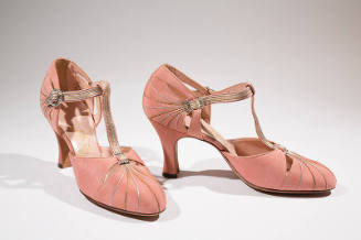 Pair of pink T-strap evening shoes with silver and gold piping running from toes to T-strap and…