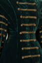 Torso detail view of Hussar-style horizontal gold braid trim with buttons on sleeves and front …