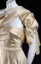 Torso view of ivory two-piece dress showing strapless bodice and stole tied at right shoulder