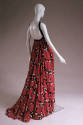 Back view of rose print dress showing black shoulder straps circling front of neck with gathere…