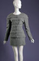 Soft long sleeve gray armor suit with horzontal tucks and decorative buttons with matching skir…