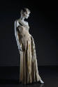 Floor length sheer ivory goddess evening dress in tight pleats, asymmetrically draped over fitt…