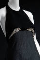 Detail of black halter top dress with rhinestones under bust 