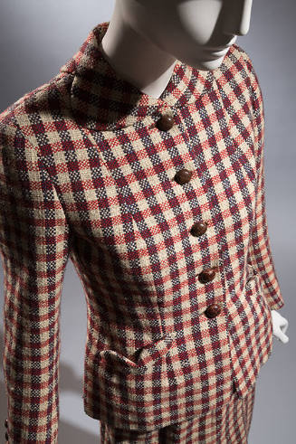 Red, grey and blue checked suit with five center buttons, round scalloped collar and knee lengt…