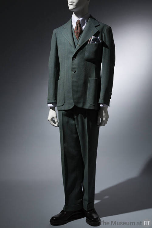 Suit in green and blue tweed; single breasted jacket, cuffed pants 