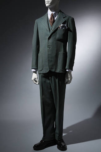 Suit in green and blue tweed; single breasted jacket, cuffed pants 