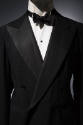 Tuxedo jacket with white undershirt and black bow tie