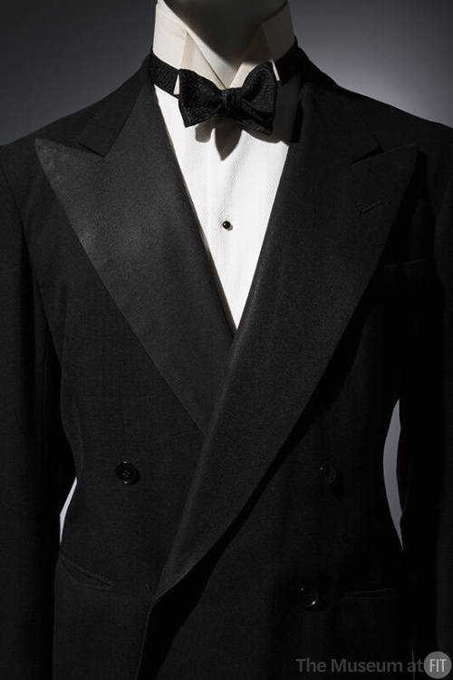 Tuxedo jacket with white undershirt and black bow tie