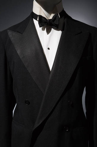 Tuxedo jacket with white undershirt and black bow tie