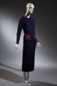 Blue knit hip length button front jacket with red ribbed collar, cuffs and pockets, blue knit a…