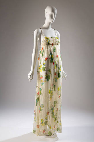 Summer evening dress in sheer white printed with design of long stem red roses