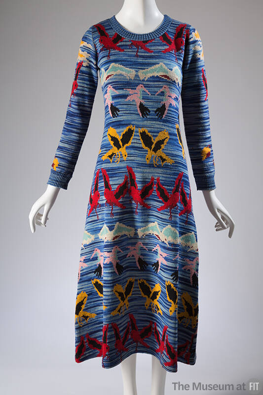 Blue space dyed sweater dress with pink, blue, red, black and white horizontal bands of bird mo…