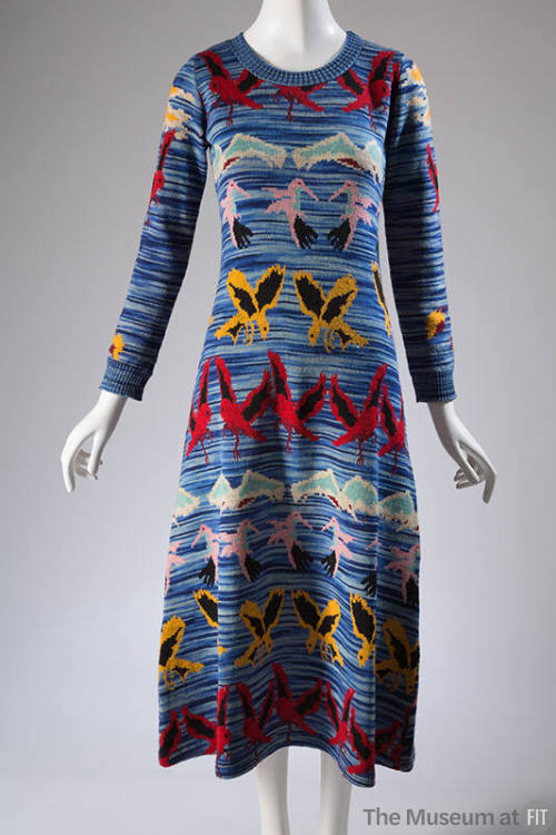 Blue space dyed sweater dress with pink, blue, red, black and white horizontal bands of bird mo…