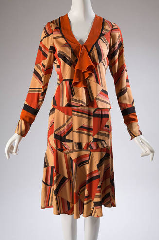 Two piece, retro 1920/30's styled dress with geometric print in beige, orange, black, and rose