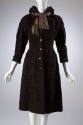 Brown, knee length hooded coat with wide, lightly padded shoulders and self tie bow at collar