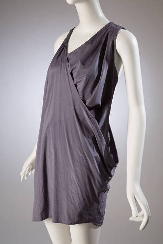 Sleeveless grey draped wrap mini dress, round neckline with one wide shoulder strap 