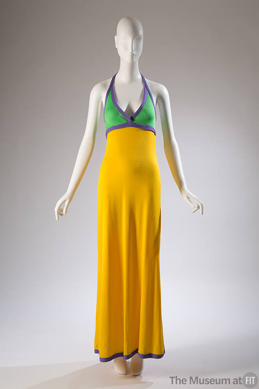 Floor length yellow dress with green halter top trimmed with purple