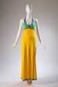 Floor length yellow dress with green halter top trimmed with purple