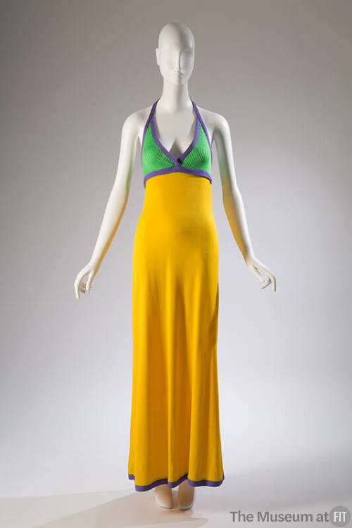 Floor length yellow dress with green halter top trimmed with purple