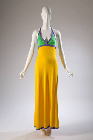 Floor length yellow dress with green halter top trimmed with purple