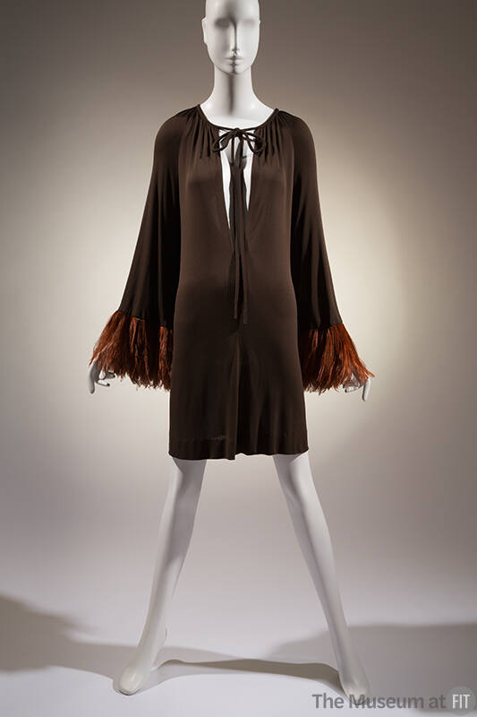 Brown short evening dress, shirred to oval neckline with self string ties; long sleeves; wide b…
