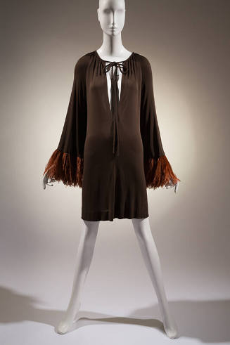 Brown short evening dress, shirred to oval neckline with self string ties; long sleeves; wide b…