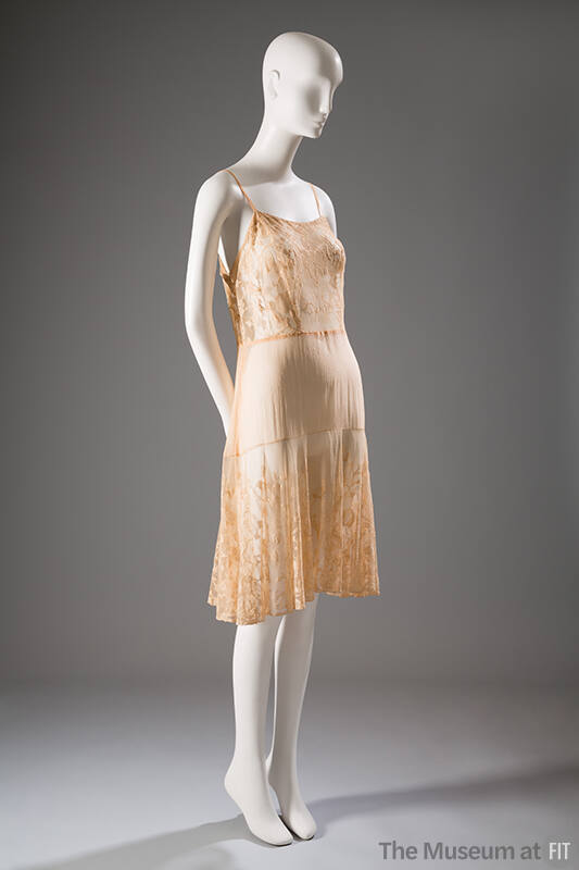 Beige slip with spaghetti straps, floral lace bodice and flounce knee length skirt