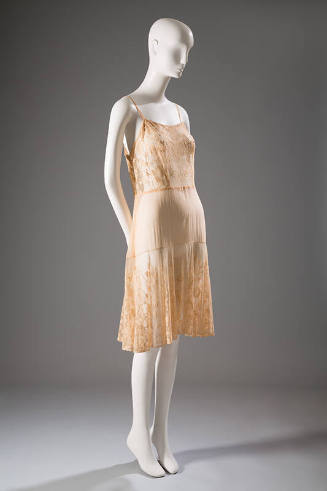 Beige slip with spaghetti straps, floral lace bodice and flounce knee length skirt