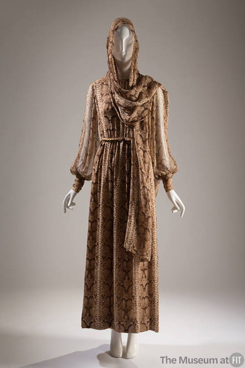 Ankle length dress in brown reptile print with long sleeves cinched at wrist and matching stole…
