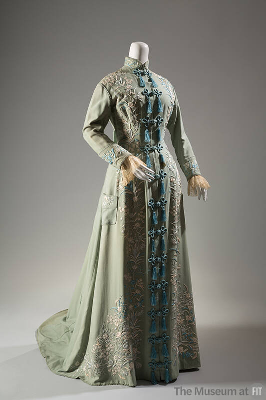 Floor length light green morning robe with symmetrical floral embroidery and train