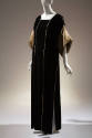 Black velvet square neck floor length dress with gold lamé turn back sleeves and gold trim