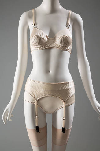 Off-white bra, garter belt and panties with black stitching 