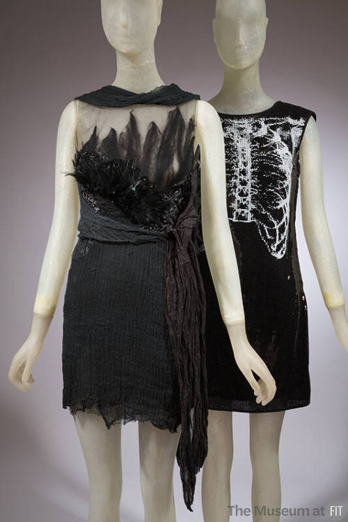 Left: black sleeveless mini dress with sheer feathered bodice and crinckled skirt Right: black …