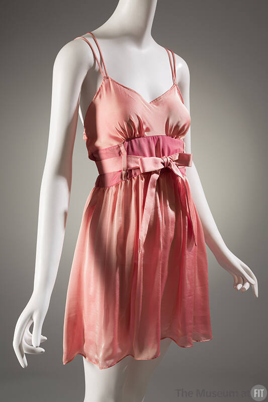 Pink baby doll style slip with tie belt at waist and spaghetti straps
