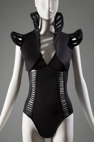 Black body suit with rib like cut-out design, low V neckline, and double shoulder sraps with bo…