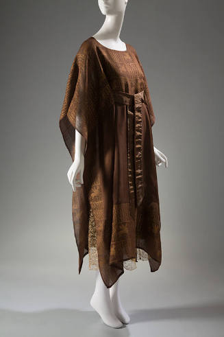 Brown silk calf length poncho style gown with gold block lattice and griffin pattern with ribbo…