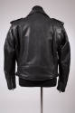 Back view of black leather jacket showing tapered sleeves with zippers on each cuff