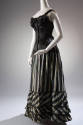 Black floor length underskirt with green, yellow, and purple vertical stripes styled with black…