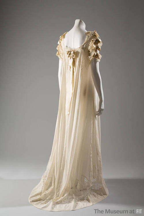 off-white night gown with satin bows, short lace sleeves, and ribbon on upper back