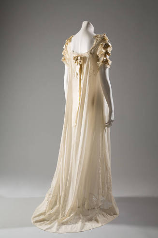 off-white night gown with satin bows, short lace sleeves, and ribbon on upper back