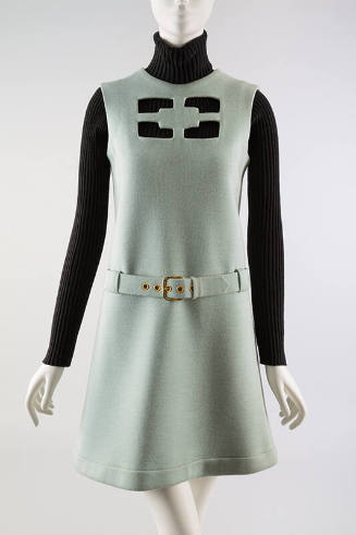 Aqua knee length dress with geometric cut out on chest & belt, styled with black longsleeve tur…
