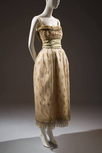 Cream net evening dress embroidered with yellow flowers, gilt sequins, and crystal beads