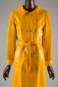 Bright yellow double breasted vinyl coat with matching belt and knit cotton sleeves