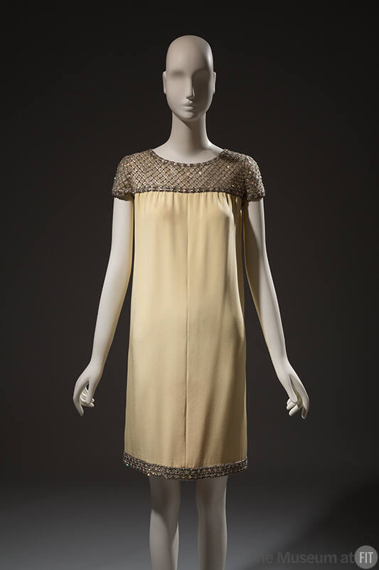 Pale yellow crepe dress, cap sleeves embroidered with sequins and rhinestones