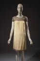 Pale yellow crepe dress, cap sleeves embroidered with sequins and rhinestones