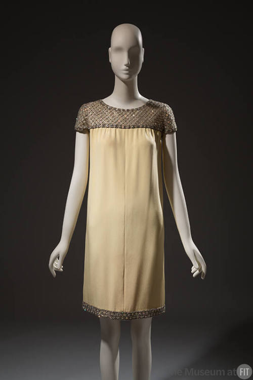 Pale yellow crepe dress, cap sleeves embroidered with sequins and rhinestones