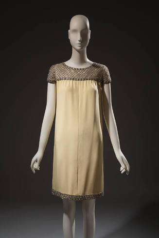 Pale yellow crepe dress, cap sleeves embroidered with sequins and rhinestones