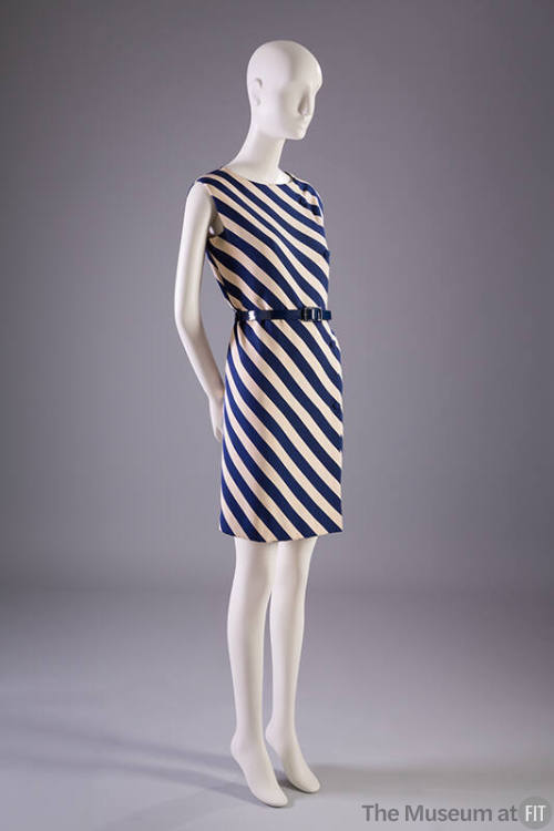 Sleeveless dress with wide navy blue and white diagonal stripes, navy belt at waist