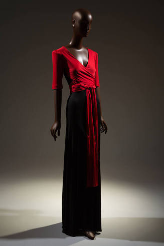 Evening dress: red v-neck top with padded short sleeves, wrap and tie extensions, long black sk…